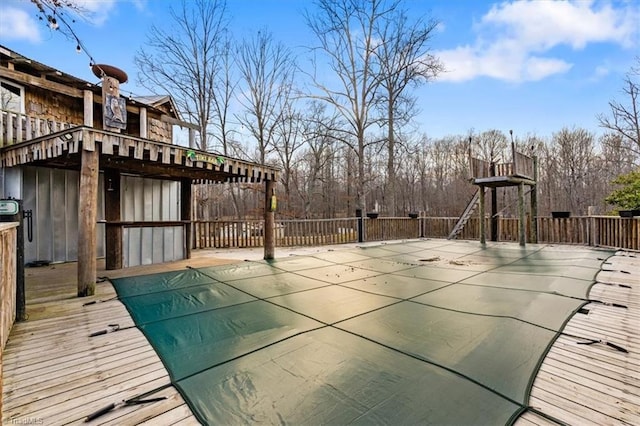 view of pool featuring a deck and a patio area