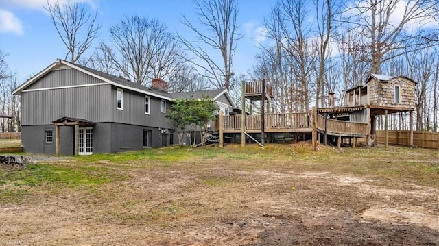 view of yard with fence and a deck