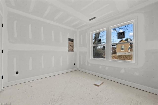 empty room featuring baseboards