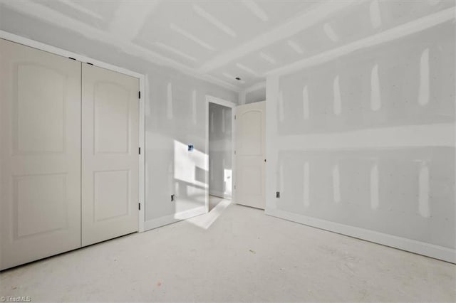 unfurnished bedroom with a closet