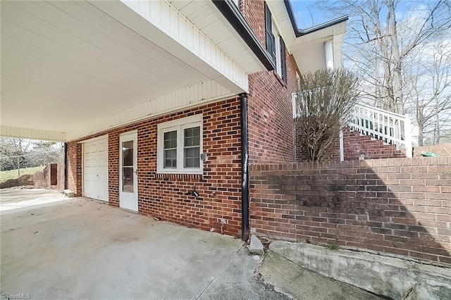 view of side of property with a garage