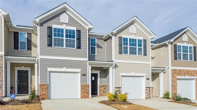 1914 Frost Dr, Haw River, NC 27258 - view of property with an attached garage, driveway, and brick siding