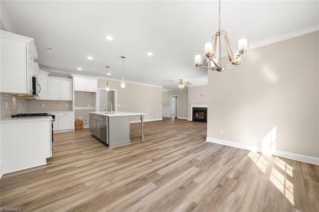 6969 Orchard Path Dr, Clemmons, NC 27012 - kitchen with open floor plan, crown molding, appliances with stainless steel finishes, recessed lighting, and backsplash