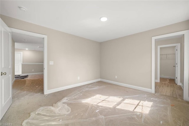 6969 Orchard Path Dr, Clemmons, NC 27012 - unfurnished bedroom featuring carpet flooring and a walk in closet