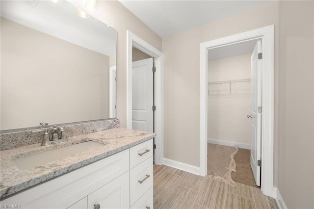 6969 Orchard Path Dr, Clemmons, NC 27012 - bathroom with a spacious closet and vanity