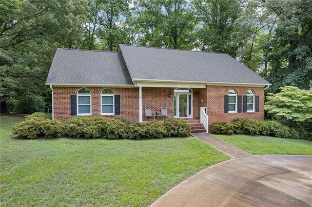 646 Terrace Dr, Lexington, NC 27295 - view of front of property with roof with shingles, a front lawn, and brick siding