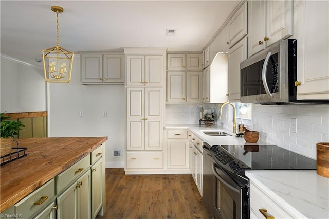 277 Sunset Blvd, Lexington, NC 27292 - kitchen with wooden counters, visible vents, appliances with stainless steel finishes, tasteful backsplash, and a sink
