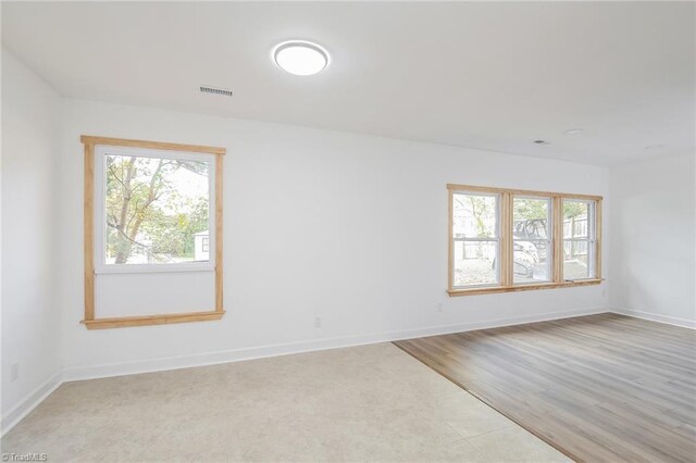 unfurnished room featuring light hardwood / wood-style flooring