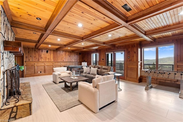 living room with coffered ceiling, wooden walls, beam ceiling, and wooden ceiling