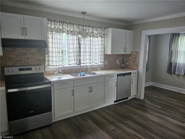 kitchen featuring white cabinets, stainless steel appliances, backsplash, dark wood-type flooring, and sink