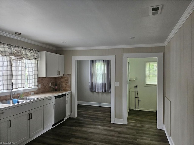 kitchen featuring white cabinetry, dark hardwood / wood-style floors, tasteful backsplash, and stainless steel dishwasher