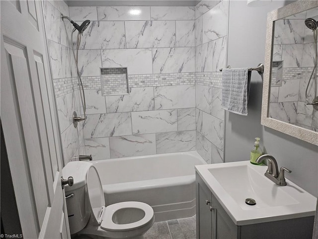 full bathroom featuring tile flooring, vanity, toilet, and tiled shower / bath combo