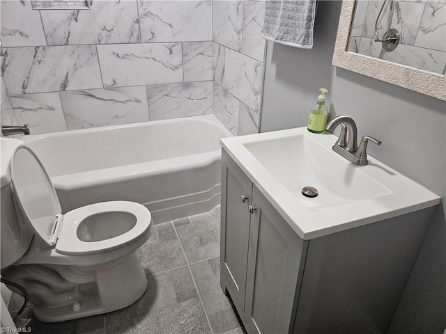 full bathroom featuring tiled shower / bath, toilet, tile floors, and large vanity