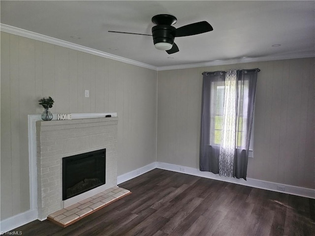 unfurnished living room featuring a brick fireplace, ceiling fan, ornamental molding, and dark wood-type flooring