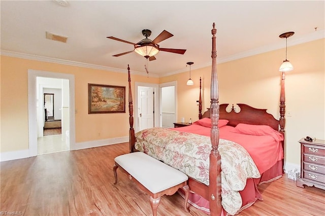 bedroom featuring light hardwood / wood-style floors, ceiling fan, and crown molding