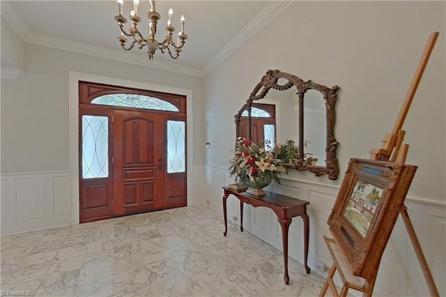 tiled foyer with a notable chandelier, crown molding, and a healthy amount of sunlight