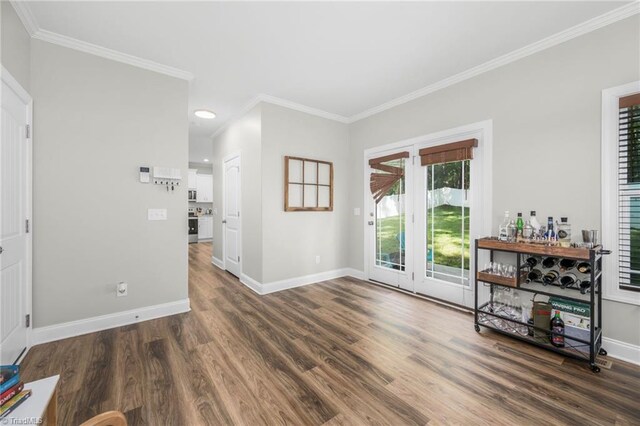 385 Apache Dr, Winston-Salem, NC 27107 - unfurnished living room featuring baseboards, wood finished floors, ornamental molding, and recessed lighting