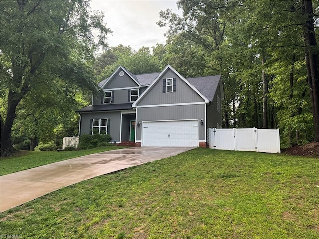 385 Apache Dr, Winston-Salem, NC 27107 - traditional-style home with a gate, concrete driveway, and view of wooded area