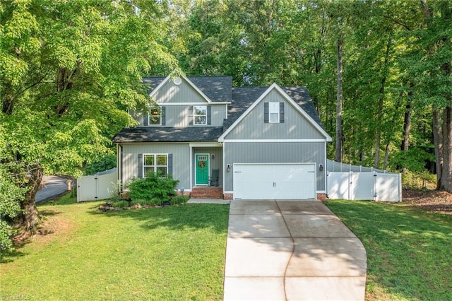 385 Apache Dr, Winston-Salem, NC 27107 - view of front facade with a gate, concrete driveway, and roof with shingles