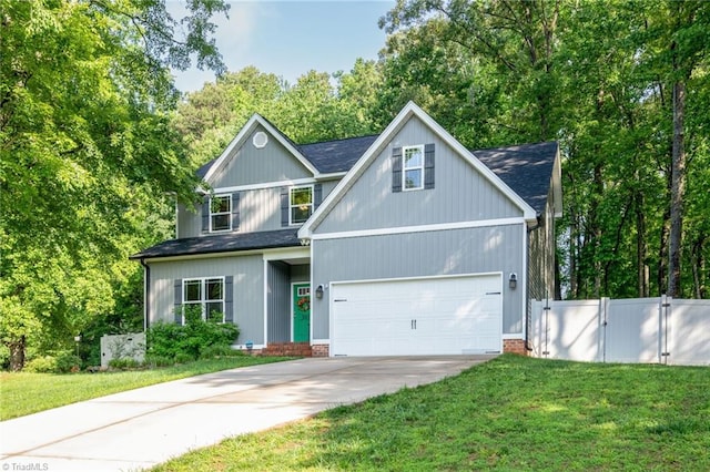 385 Apache Dr, Winston-Salem, NC 27107 - traditional home with driveway, a gate, a shingled roof, and view of wooded area