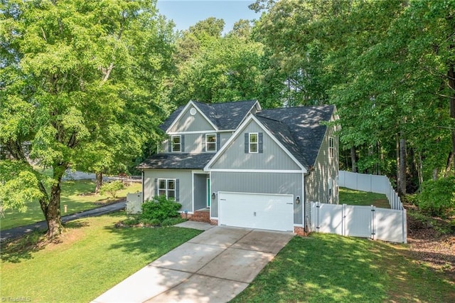 385 Apache Dr, Winston-Salem, NC 27107 - view of front of house featuring driveway, an attached garage, a gate, and roof with shingles
