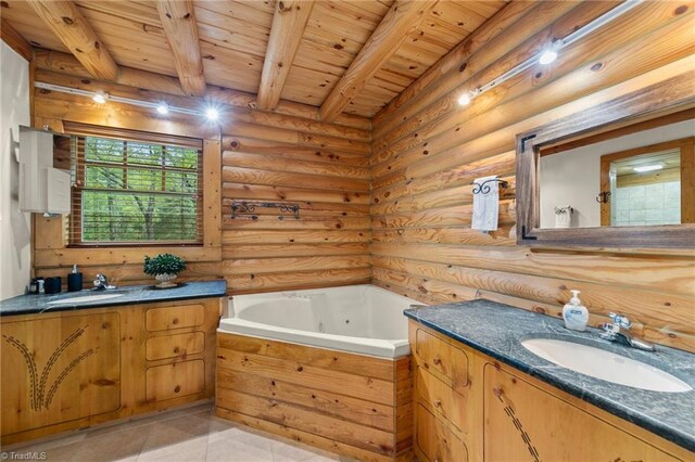 bathroom featuring vanity, beam ceiling, rustic walls, and a washtub