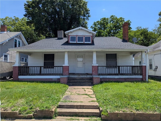 423 Tate St, High Point, NC 27260 - bungalow-style home featuring a chimney, a porch, and a shingled roof