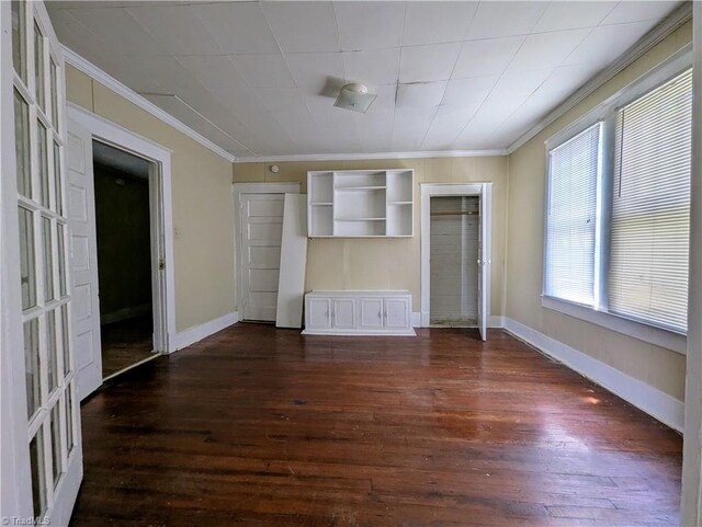 423 Tate St, High Point, NC 27260 - unfurnished bedroom with crown molding and dark wood-style floors
