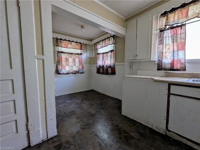 423 Tate St, High Point, NC 27260 - kitchen with crown molding, light countertops, and white cabinetry