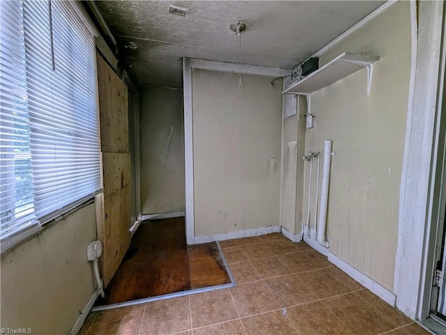 423 Tate St, High Point, NC 27260 - interior space featuring tile patterned floors and baseboards