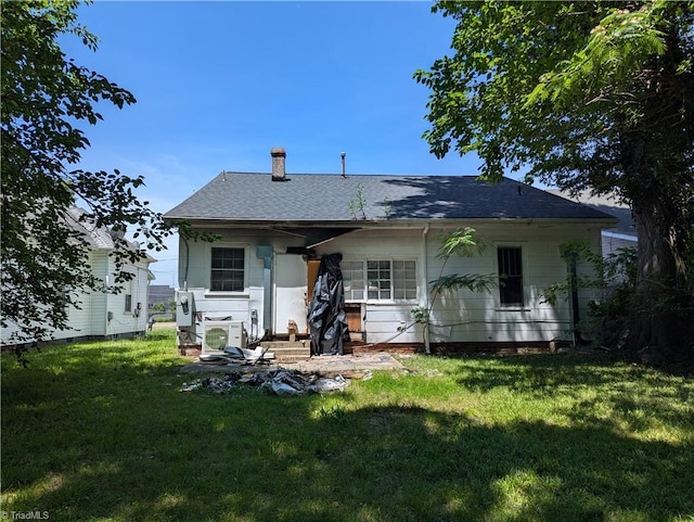 423 Tate St, High Point, NC 27260 - rear view of house featuring a chimney, a lawn, and a shingled roof