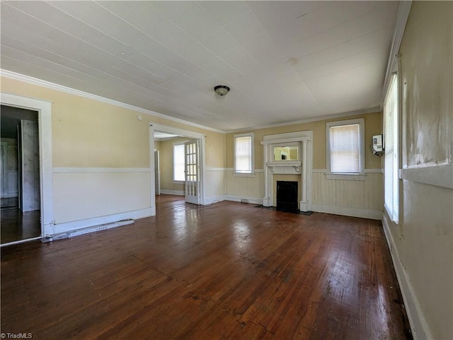 423 Tate St, High Point, NC 27260 - unfurnished living room with hardwood / wood-style flooring, a fireplace with flush hearth, and ornamental molding