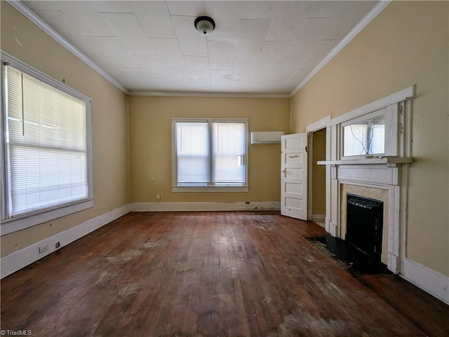 423 Tate St, High Point, NC 27260 - unfurnished living room featuring an AC wall unit, hardwood / wood-style floors, a high end fireplace, and crown molding