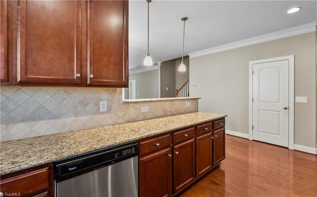 kitchen with dishwasher, backsplash, light stone countertops, and crown molding