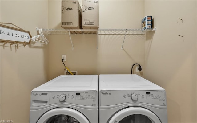 washroom with laundry area and independent washer and dryer