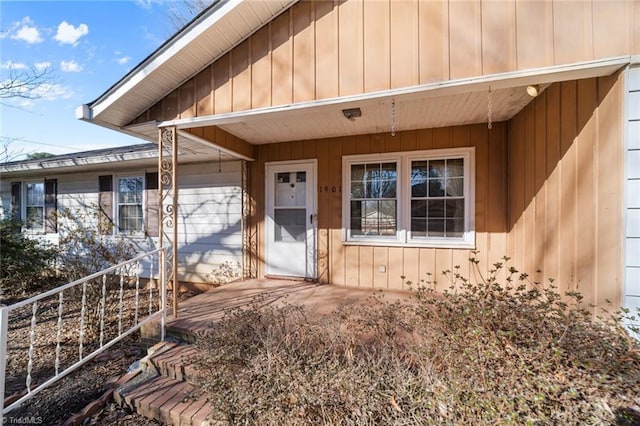 property entrance with a porch and board and batten siding