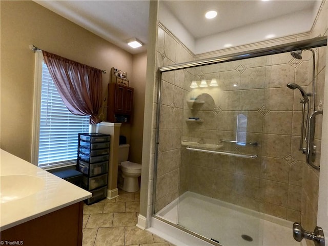 full bathroom with tile patterned flooring, a shower stall, vanity, toilet, and recessed lighting