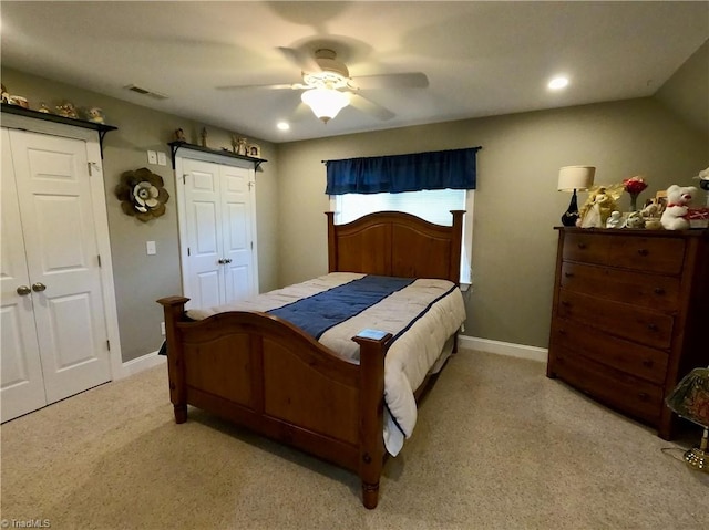 bedroom featuring light carpet, multiple closets, baseboards, a ceiling fan, and recessed lighting
