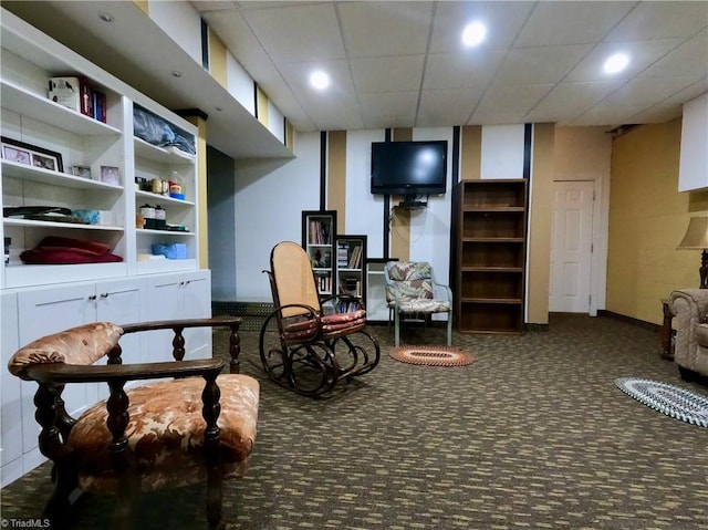 sitting room featuring carpet floors, recessed lighting, and baseboards