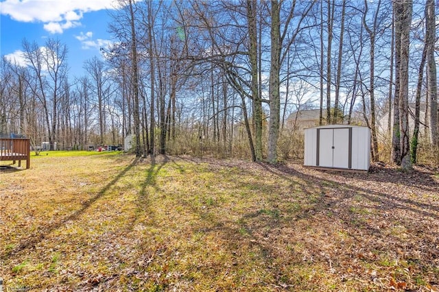 view of yard featuring a shed and an outbuilding