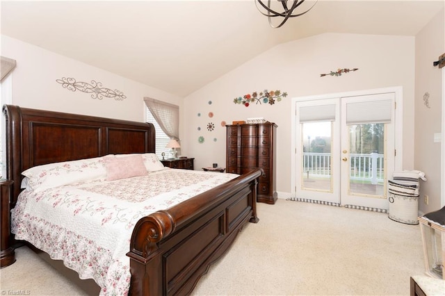 bedroom featuring multiple windows, light carpet, and access to exterior