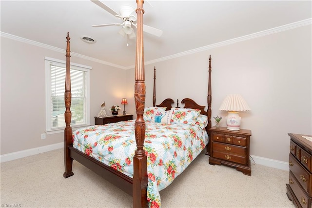 carpeted bedroom with ornamental molding and ceiling fan