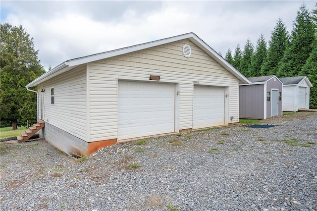 garage featuring wooden walls