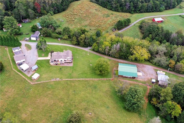 birds eye view of property with a rural view