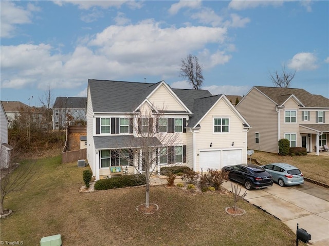 view of front facade featuring central AC, a front lawn, and a garage