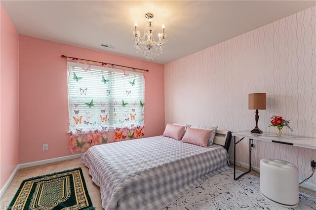 carpeted bedroom with visible vents, baseboards, and a notable chandelier