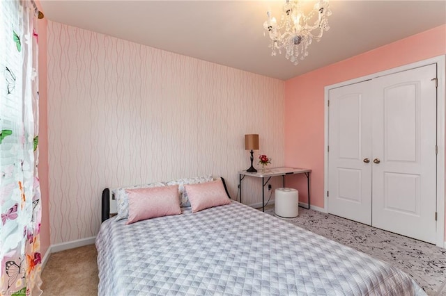 carpeted bedroom featuring an inviting chandelier, baseboards, and wallpapered walls