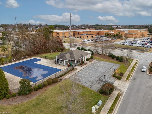 view of swimming pool featuring fence