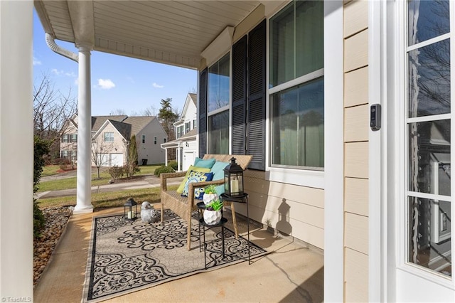 view of patio / terrace with covered porch and a residential view