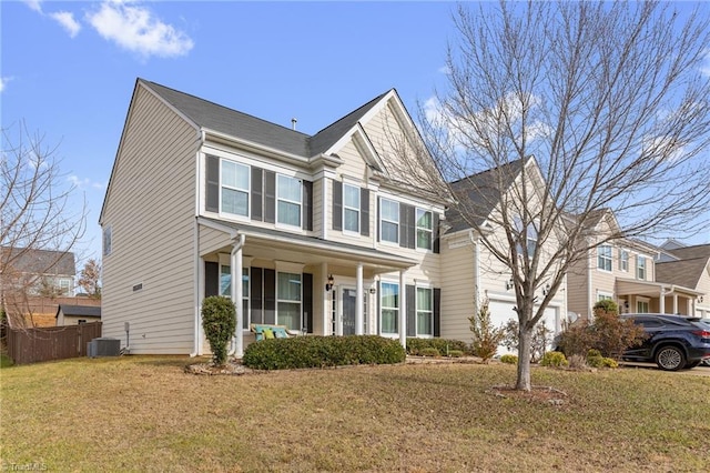 view of front of home with covered porch, central AC unit, a front yard, fence, and a garage